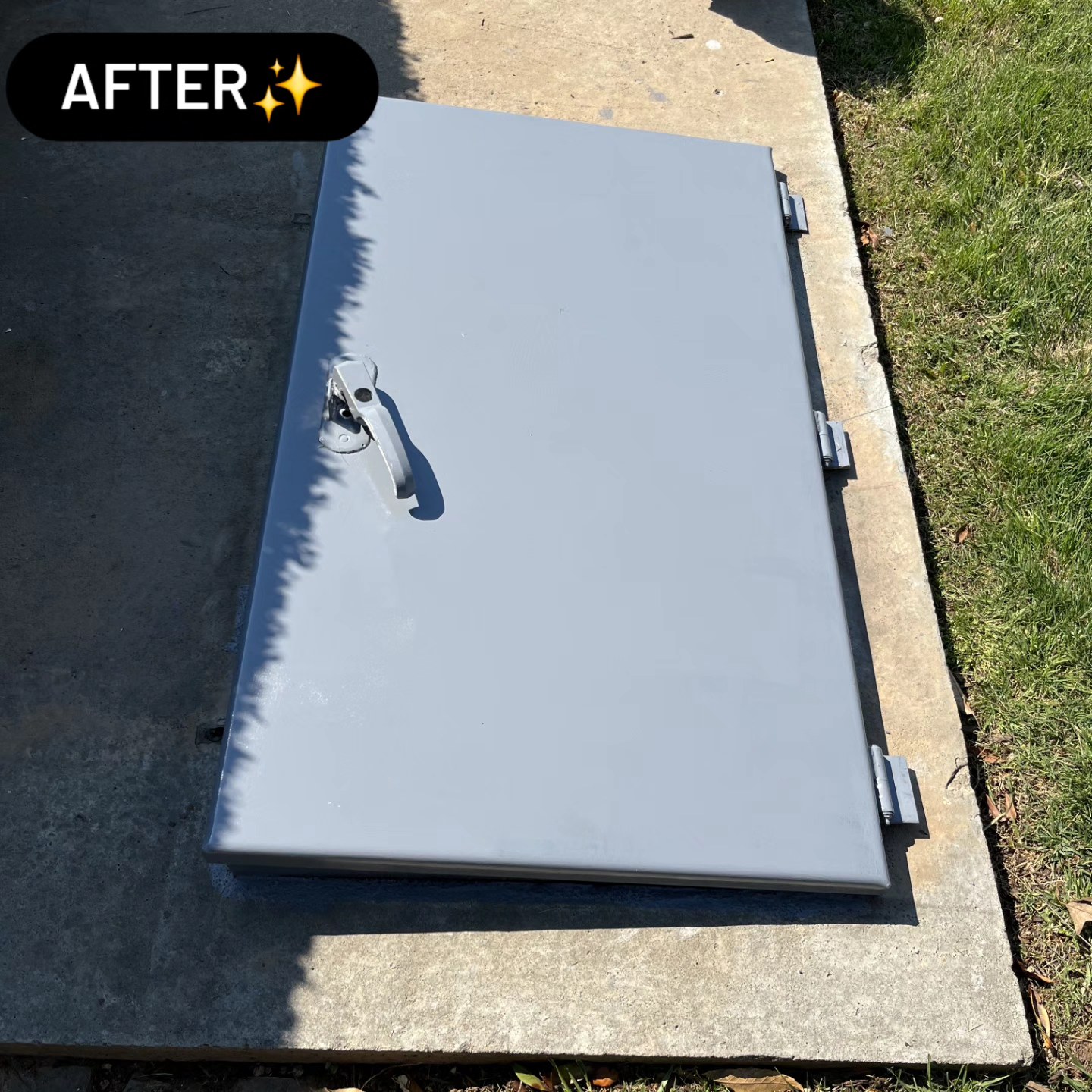 Storm shelter door after restoration — freshly sanded, sealed and repainted